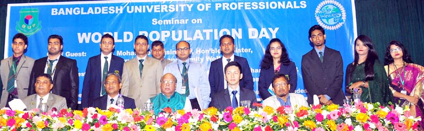 Health Minister Mohammed Nasim, MP is seen with the participants of a seminar organized to mark the World Population Day at Bangladesh University of Professionals. Department of Public Administration of the University held the seminar at Bijoy Auditorium