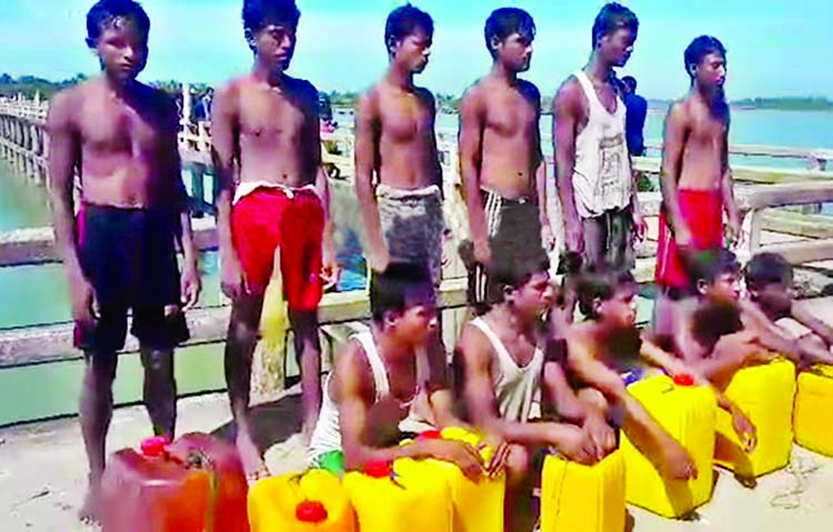 Coast guard rescued at least 11 Rohingyas from Naf River those tried to swim ashare with the help of plastic raft. This photo was taken from Shahpari Dwip on Wednesday.