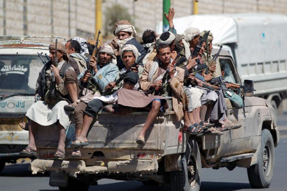 Armed Yemeni Shiite Huthi anti-government rebels ride on a pick-up truck in the capital Sanaa .
