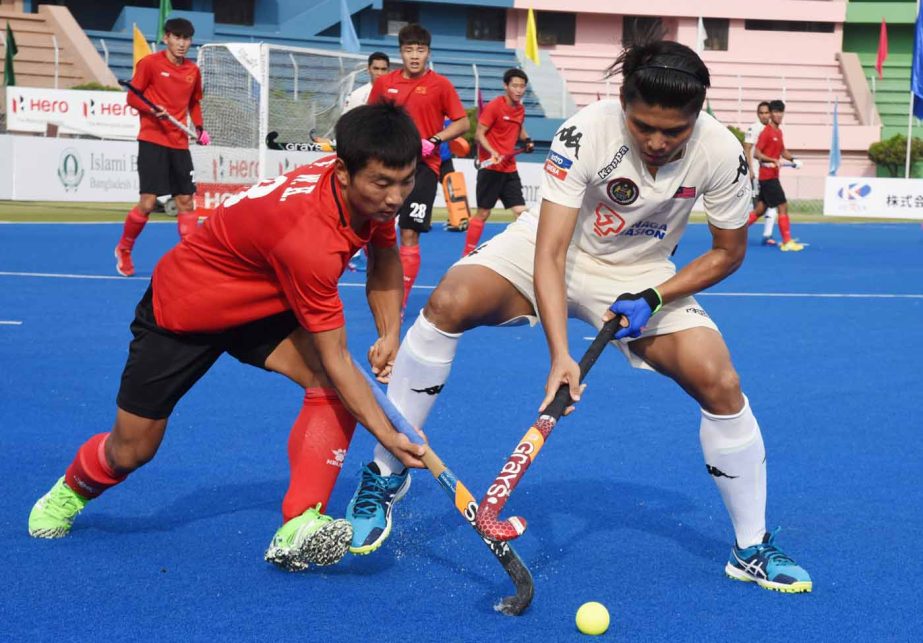 An action from the match of the Hero Asia Cup Hockey between Malaysia and China at the Moulana Bhashani National Hockey Stadium on Thursday.