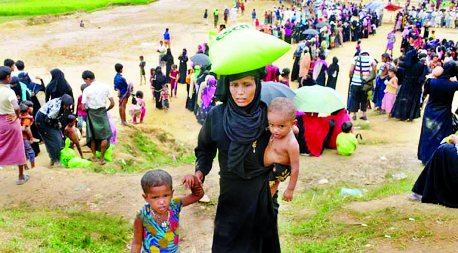 Thousands of Rohingyas waiting in queue for relief from different camps at Kutupalong. This photo was taken on Thursday.