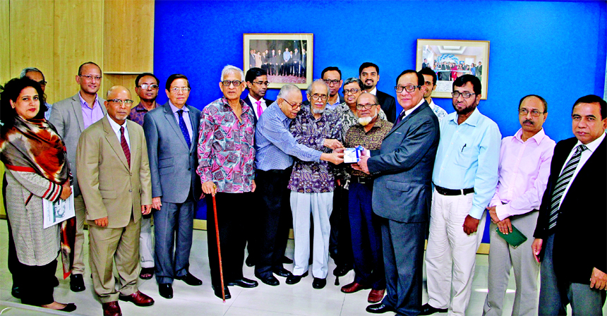 A Rouf Chowdhury, Chairman of Bank Asia Limited, handing over a cheque of Tk.10m to Professor Dr. MA Rakib, President of National Heart Foundation, Sylhet for set up a post CCU unit of its hospital at National Heart Foundation head office in the city on T