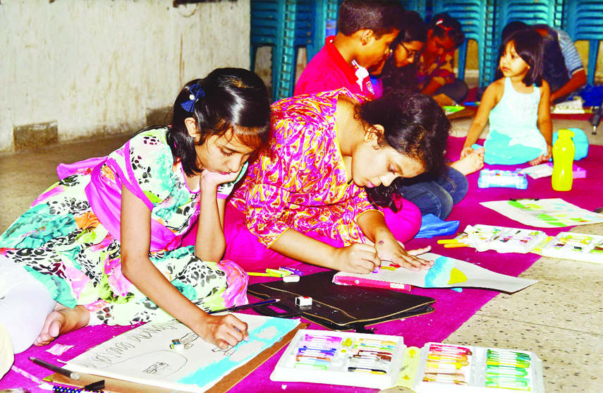 Children of the Jatiya Press Club members engrossed in drawing at a painting competition in the Hall Room of the club on Friday marking 63rd founding anniversary of the club.