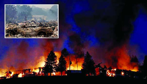 Smoke and flame rise from the Hilton Sonoma Wine Country during the Tubbs Fire in Santa Rosa, Inset : Remains of a burned property is seen along Highway 12 during the Nuns Fire in Sonoma.