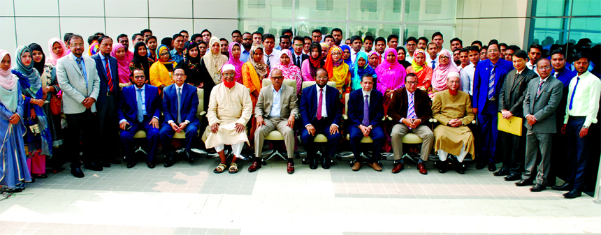 Abdus Samad Labu, Chairman of Al-Arafah Islami Bank Limited, poses with the participants of 10-day long 'Foundation Course' on banking for newly recruited officers at the bank's head office in the city on Sunday. Md. Habibur Rahman, Managing Director,