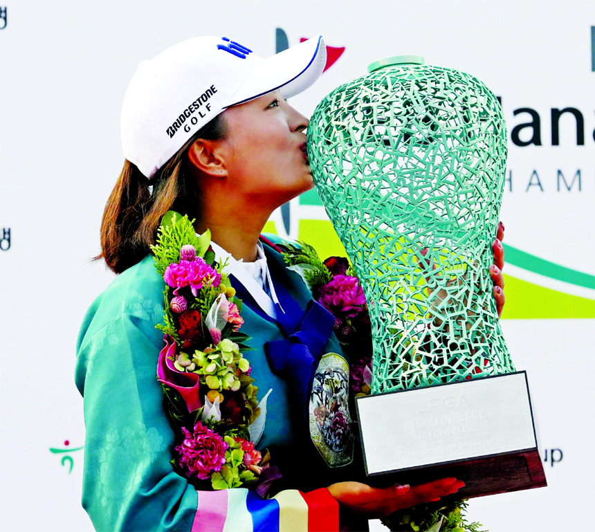 Jin Young Ko of South Korea kisses her trophy after winning the LPGA KEB HanaBank Championship golf tournament at Sky72 Golf Club in Incheon, South Korea on Sunday.