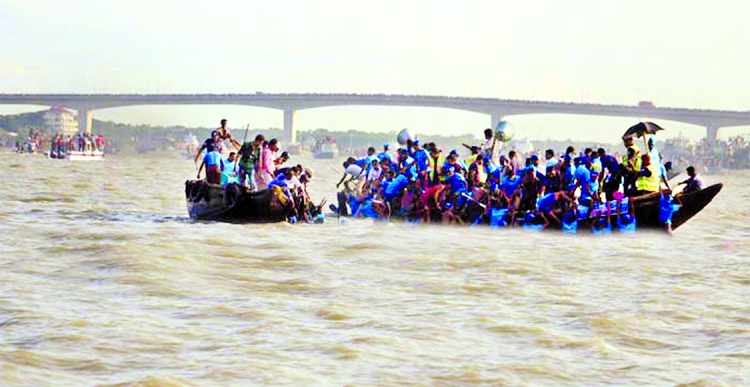 A boat capsized during the traditional boat race at Rupsha River in Khulna Rescue team trying to rescue the people on Sunday.