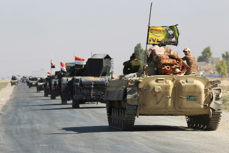 Iraqi forces drive towards the disputed city of Kirkuk on Monday.