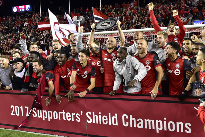 Players of Toronto FC celebrate with the Supporters' Shield following their win over the Montreal Impact in MLS soccer game action in Toronto on Sunday.