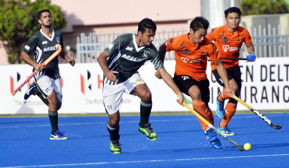 An action from the match of the 'Super Four' of the Hero Asia Cup Hockey between Malaysia and Pakistan at the Moulana Bhashani National Hockey Stadium on Wednesday.