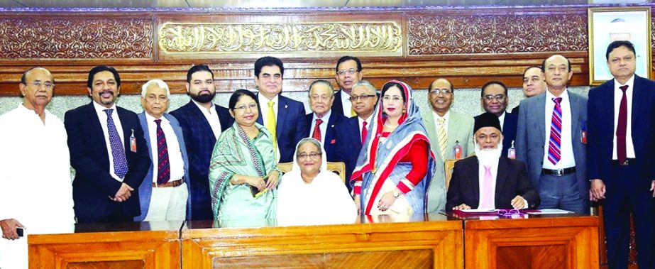 Prime Minister Sheikh Hasina, attends at photo sessions after receiving Tk 5 crore as donation from the following banks for the financial assistance to the Rohingya refugees at her office on Monday.
