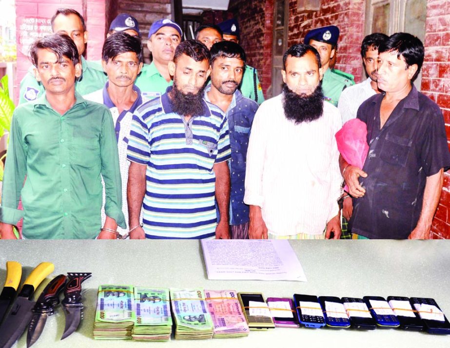 Police arrested eight members of inter-district dacoit's gang and recovered a huge quantity of sharp weapons along with cash Tk 1, 75,000 from their possession. Police also seized an engine boat used by the dacoits for committing dacoity. The photo was t