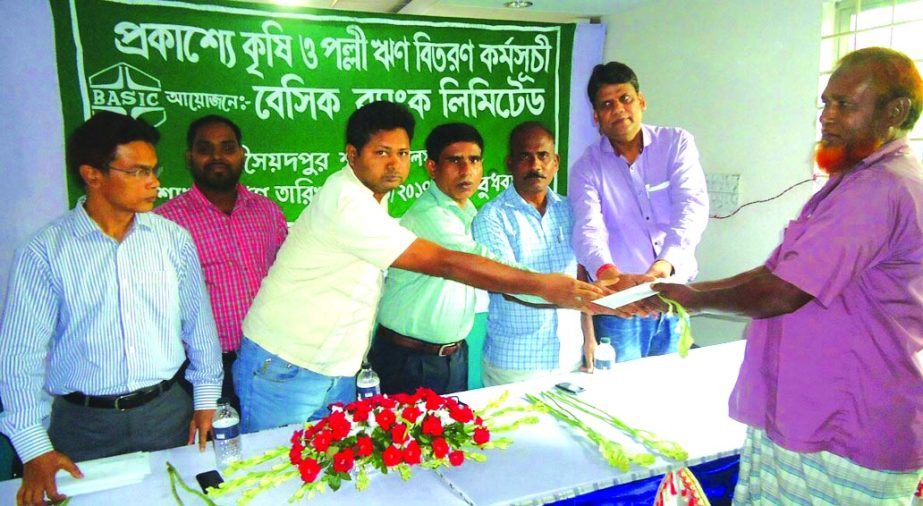 Basic Bank Limited of Saidpur Branch, Nilphamari publicly distributed agricultural loans of Tk 10 lakh among the farmers at at the branch office of the bank recently. Rajshahi Krishi Unnayan Bank Saidpur Branch Manager Md. Abdus Salam Khan was also prese