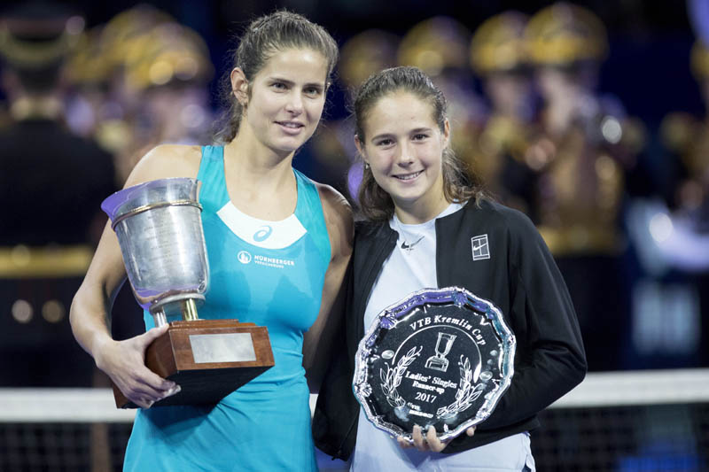 Julia Goerges of Germany poses with the trophy after defeating Daria Kasatkina of Russia (right) in the final match at the Kremlin Cup tennis tournament in Moscow, Russia on Saturday.