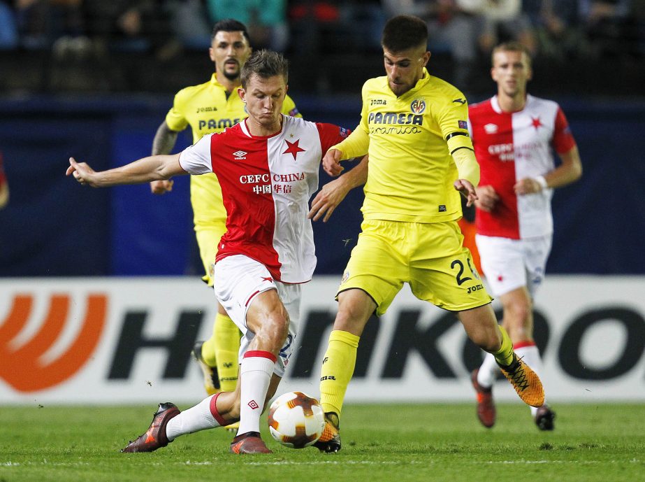 Slavia Prague's Tomas Necid (left) challenges for the ball with Villarreal's Roberto Soriano during their UEFA Europa League group A soccer match between Villarreal and Slavia Prague's at the Ceramica stadium in Villarreal, Spain on Thursday.