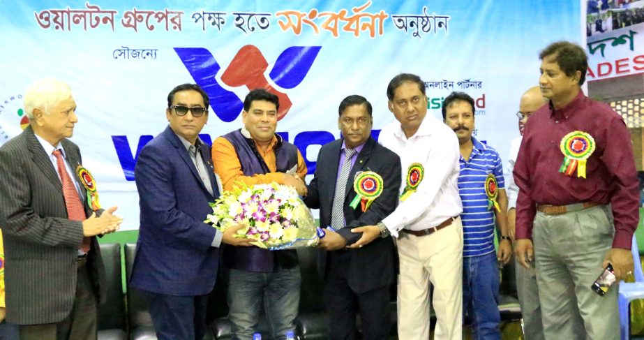 Operative Director (Head of Sports & Welfare Department) of Walton Group FM Iqbal Bin Anwar Dawn accords a reception to General Secretary of Bangladesh Taekwondo Federation Mahmudul Islam Rana at the Gymnasium of National Sports Council on Tuesday. Mahmud