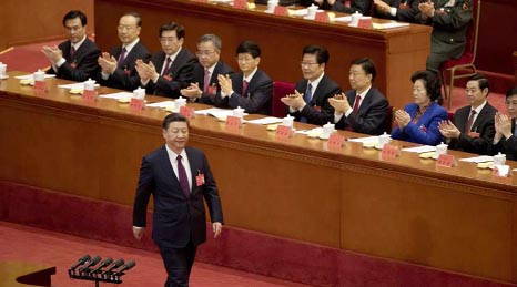 Chinese President Xi Jinping is applauded as he walks to the podium to deliver his speech at the opening ceremony of the 19th Party Congress held at the Great Hall of the People in Beijing.