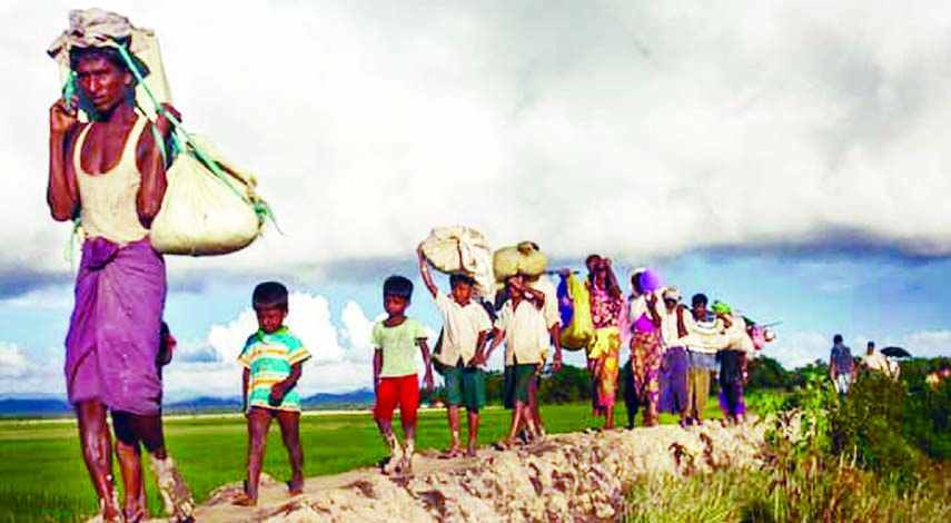 EXODUS CONTINUES: About 2500 Rohingya refugees including children and women enter Bangladesh's border as they stayed at Shahpari Dwip on Tuesday.