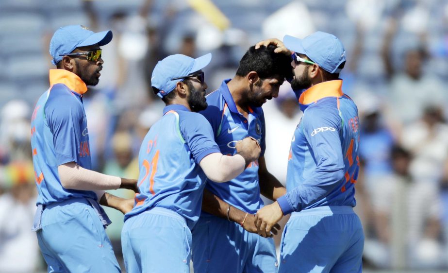 India's Jasprit Bumrah, second right, celebrates with teammates the dismissal of New Zealand captain Kane Williamson during their second one-day international cricket match in Pune, India on Wednesday. New Zealand scored 230 for 9 in 50 overs.