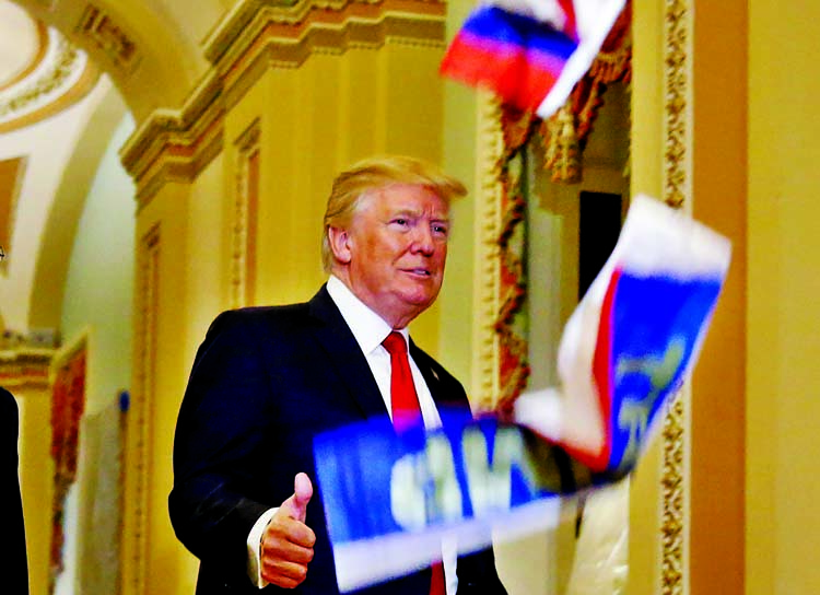 A protester threw Russian flags at President Donald Trump as he walked through the Capitol on Tuesday. Internet photo