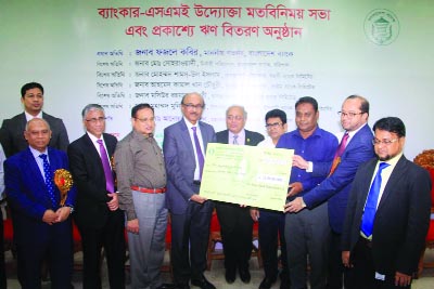 BARISAL: Fazle Kabir, Governor of Bangladesh Bank distributing loan in the view exchange programme of bankers and SME entrepreneurs at Barisal Club Auditorium as Chief Guest on Wednesday.