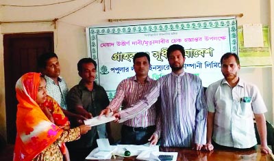 JOYPURHAT: Mustakim Mondal, Vice Chairman, Khetlal Upazila distributing cheques among the Popular DPS holders of Popular Life Insurance Company Ltd on Wednesday.