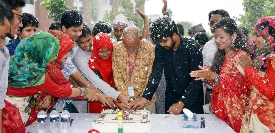 Prof Dr Nazmul Ahsan Kalimullah, BTFO, Vice Chancellor of Begum Rokeya University, Rangpur cutting cake to mark the celebration of two decades of 'Bhadon' a voluntary blood donation organization held on the University campus on Tuesday.