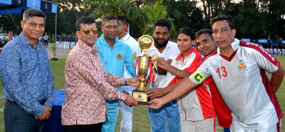 Assistant Chief of Air Staff (Admin) Air Vice Marshal M Abul Bashar giving away the champions trophy to BAF Base Bangabandhu team who won the Inter-Base Football Competition of Bangladesh Air Force (BAF) at BAF Base Zahurul Haque in Chittagong on Thursday