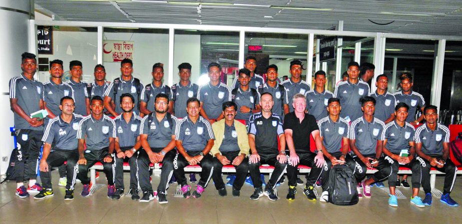 Members of Bangladesh Under-19 National Football team pose for a photo session at the Hazrat Shahjalal International Airport on Friday.