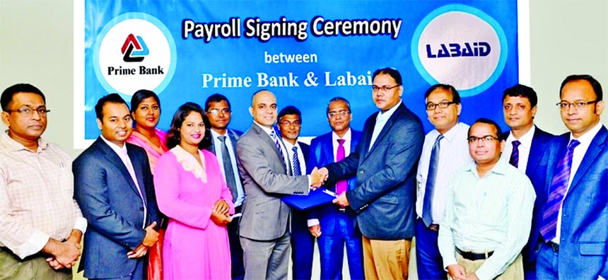 Mamur Ahmed, Head of Sales and Collection of Consumer Banking Division of Prime Bank Limited and Ahmed Dawood, FCA, Chief Financial Officer of LABAID Group, exchanging an agreement signing documents at the bank's head office in the city recently. Under t