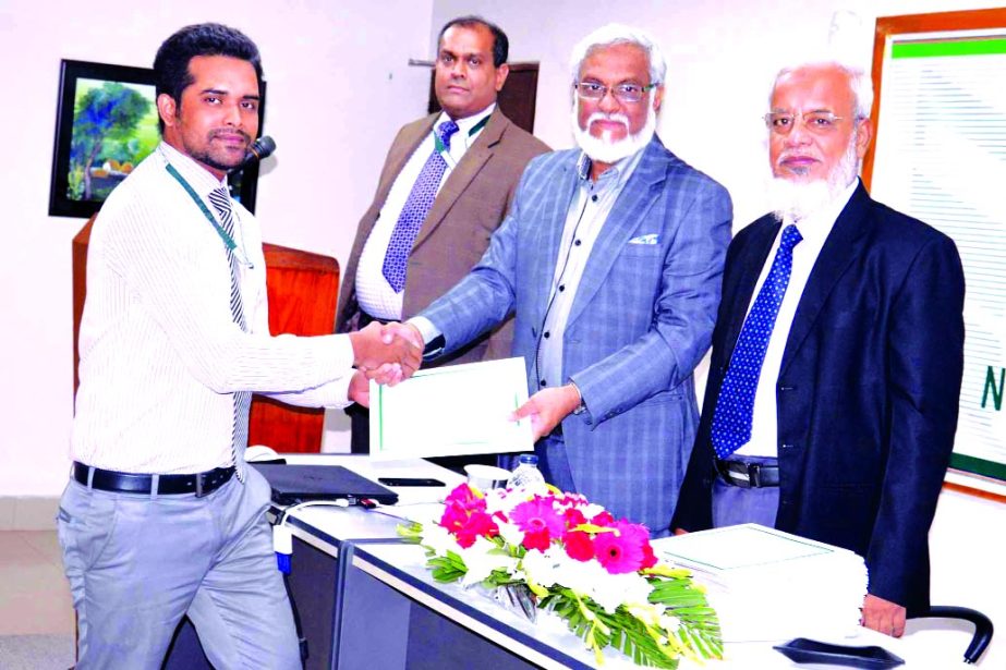 Shah Syed Abdul Bari, Head of Human Resources Division of National Bank Limited, handing over certificates among the participants of the "Credit Risk Management" (16th Batch) training programme concluding ceremony at the bank's training institute in th