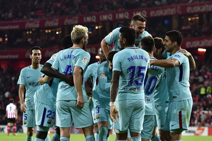 FC Barcelona's Paulinho Bezerra, center, celebrates his goal with teammate after scoring against Athletic Bilbao during the Spanish La Liga soccer match between Athletic Bilbao and FC Barcelona, at San Mames stadium, in Bilbao, northern Spain, Saturday.