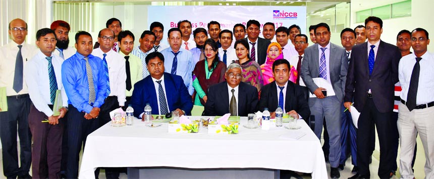 Md. Amirul Islam FCA, Chairman of NCC Bank Securities and Financial Services Limited, poses with the participants of a day-long training on "Business Performance Review" for its Executives and Branch Managers at its head office in the city recently. Mos