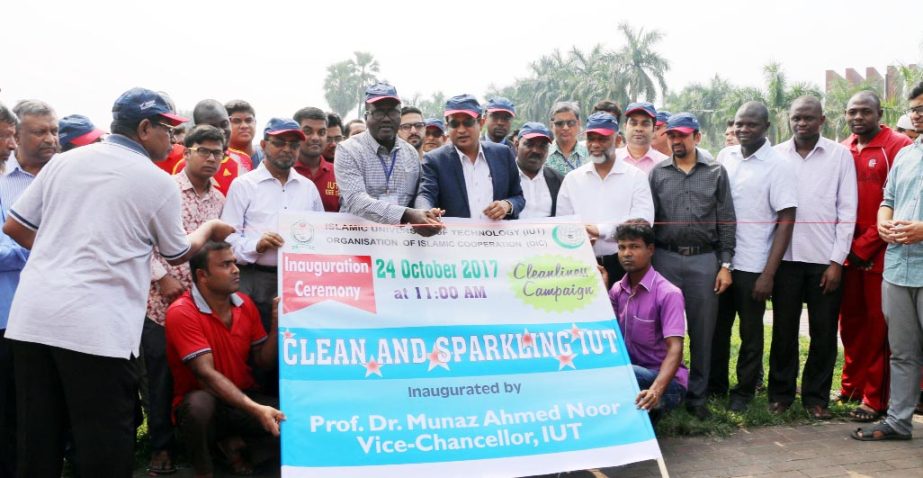 Prof Dr Munaz Ahmed Noor, Vice-Chancellor of Islamic University of Technology inaugurates a cleanliness campaign on the University campus at Board Bazar, Gazipur on Tuesday.