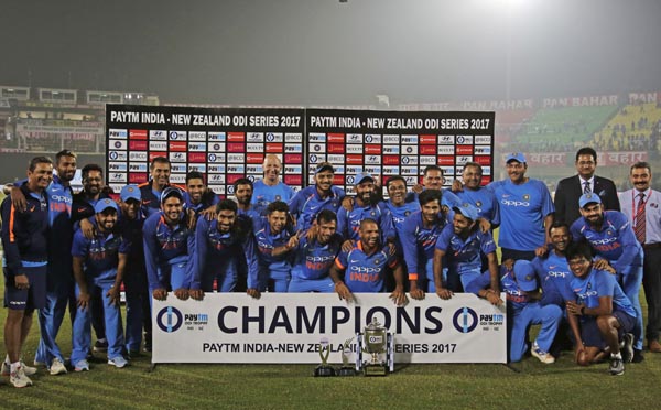 Indian team poses with the trophy after winning the one-day international cricket series against New Zealand in Kanpur, India on Sunday.