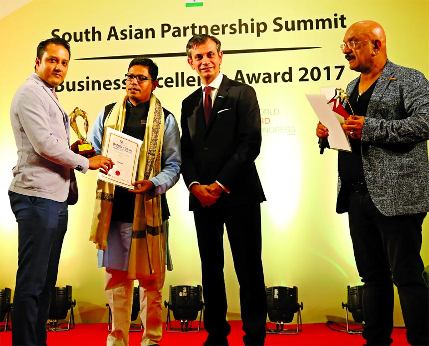 Romi F. Ahsan, Managing Director of Gemsclip, receiving a startup award from State Minister of ICT, Zunaid Ahmed Palak, MP at a hotel in the city on Sunday. E-commerce based company, Gemsclip.com, has won 'South Asian Business Excellence Award 2017' in