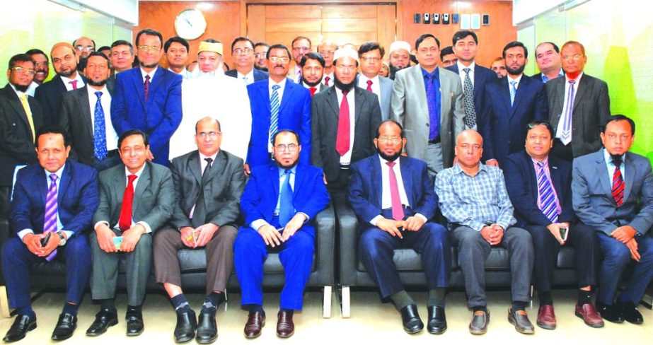 Md. Habibur Rahman, Managing Director of Al-Arafah Islami Bank Limited, poses with the participants of a Executive Development Programme on 'Supervisory Review Process (SRP) of BASEL III' at its Training and Research Institute in the city on Monday. Md.