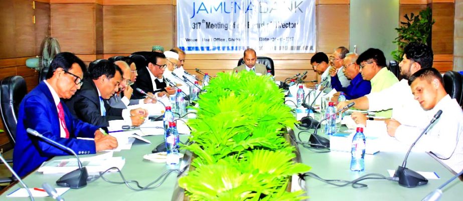 Md. Ismail Hossain Siraji, Chairman, Board of Directors of Jamuna Bank Limited, presiding over its 317th Board Meeting at its head office in the city recently. Shafiqul Alam, Managing Director of the bank and Nur Mohammed, Chairman of Jamuna Bank Foundati