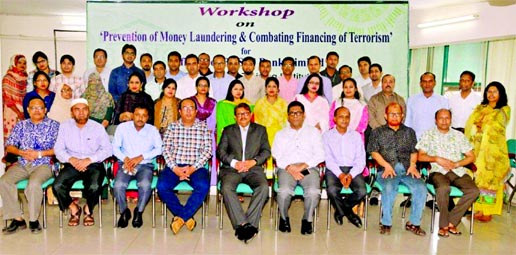Kanak Kumar Purkayastha, DMD of BASIC Bank Limited, poses with the participants of a day-long workshop on 'Prevention of Money Laundering and Combating Financing of Terrorism' at its training institute in the city recently. Senior officials of the bank