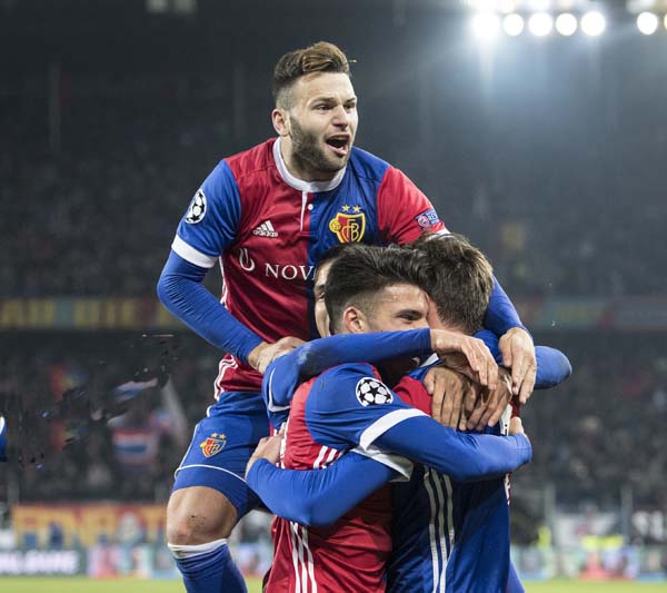 Basel's players celebrate their teams first goal during a Champions League Group A soccer match between Switzerland's FC Basel 1893 and Russia's CSKA Moskva in the St. Jakob-Park stadium in Basel, Switzerland, Tuesday.