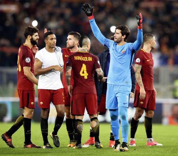 Roma goalkeeper Alisson celebrates at the end of the Champions League group C soccer match between Roma and Chelsea at the Olympic stadium in Rome on Tuesday. Rome won 3-0.