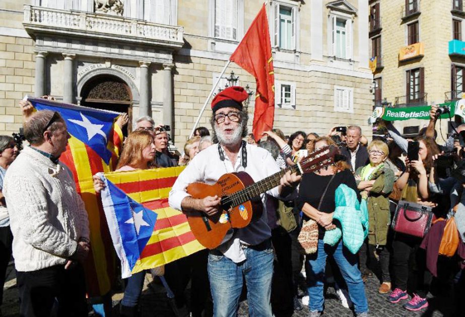 Supporters of Catalan independence gather defiantly in front of Catalan government headquarters-but Madrid's move to take swift control of their region and call elections has exposed a growing rift in secessionist ranks.