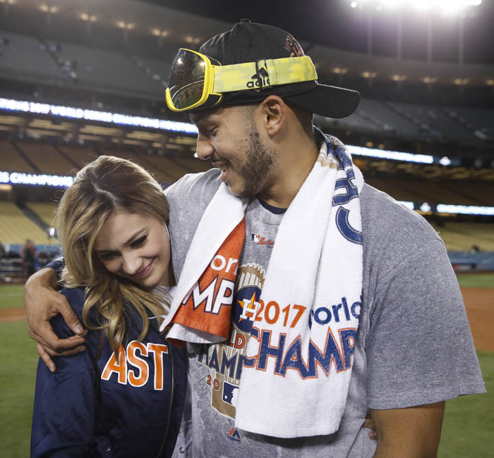 Daniella Rodriguez, former Miss Texas, talks to Houston Astros' Carlos Correa after Game 7 of baseball's World Series on Wednesday in Los Angeles. The Astros won 5-1 to win the series 4-3. Correa proposed to Rodriguez after the game.