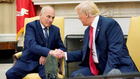 U.S. President Donald Trump shakes hands with John Kelly after he was sworn in as White House Chief of Staff in the Oval Office of the White House in Washington.