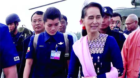 Amid continuing influx of Rohingyas who have been fleeing persecution in Myanmar by security forces, the country's de facto leader, Aung San Suu Kyi, urges her people 'not to quarrel'. In the photo taken on Thursday Suu Kyi is seen after her arrival at