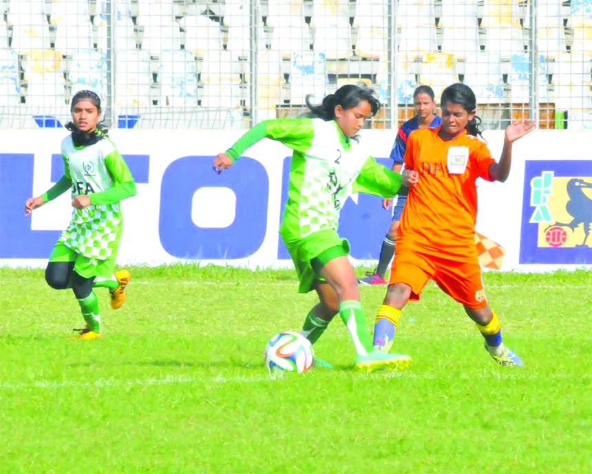 A moment of the final round match of the JFA Under-14 National Women's Football Championship between Mymensingh district team and Satkhira district team at the Bangabandhu National Stadium on Friday. Mymensingh won the match 11-0.