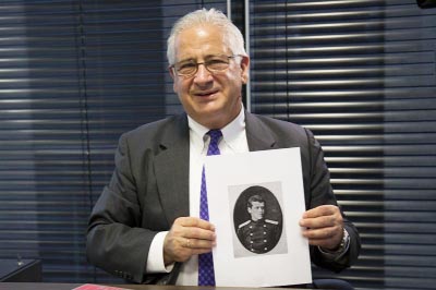 Alexis Rodzianko, the president of the American Chamber of Commerce in Russia, holds a picture of his great grandfather, Mikhail Rodzianko, during an interview with The Associated Press.