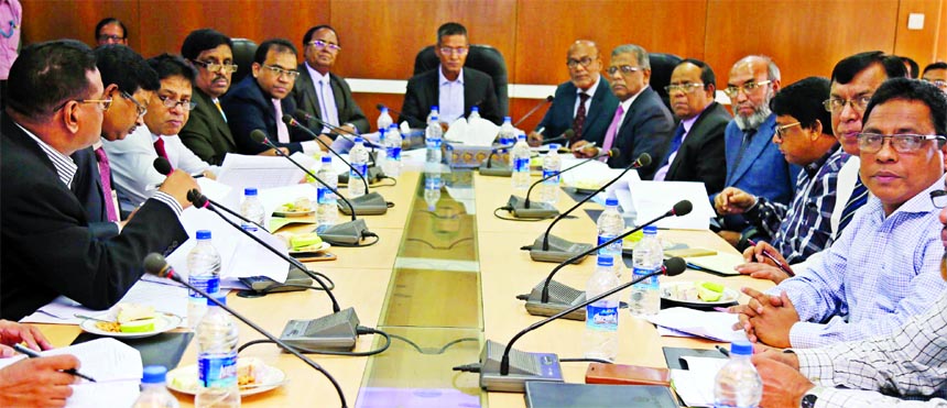 Md Abdus Salam Azad, Managing Director (Current Charge) of Janata Bank Limited, presiding over a meeting on reducing classified loan at its head office on Sunday. DMDs of the bank Md Helal Uddin, Dr Md Foroz Ali and Md Ismail Hossain and all GMs, DGMs wer