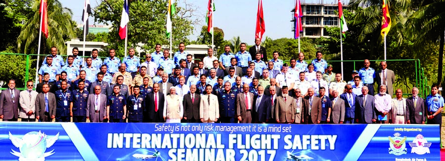 Chief of Air Staff Air Marshal Abu Esrar poses for photograph with participants in an International Flight Safety Seminar at the Falcon Hall of Bangladesh Air Force in the city's Tejgaon on Monday. ISPR photo