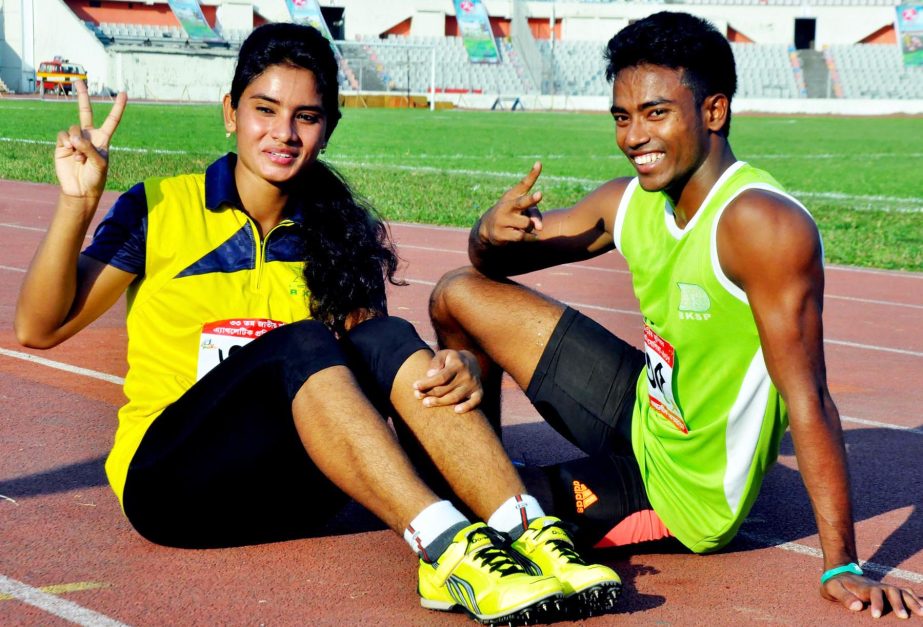 Fastest man and woman of 33rd National Junior Athletics Championship pose for photo at the Bangabandhu National stadium on Monday.